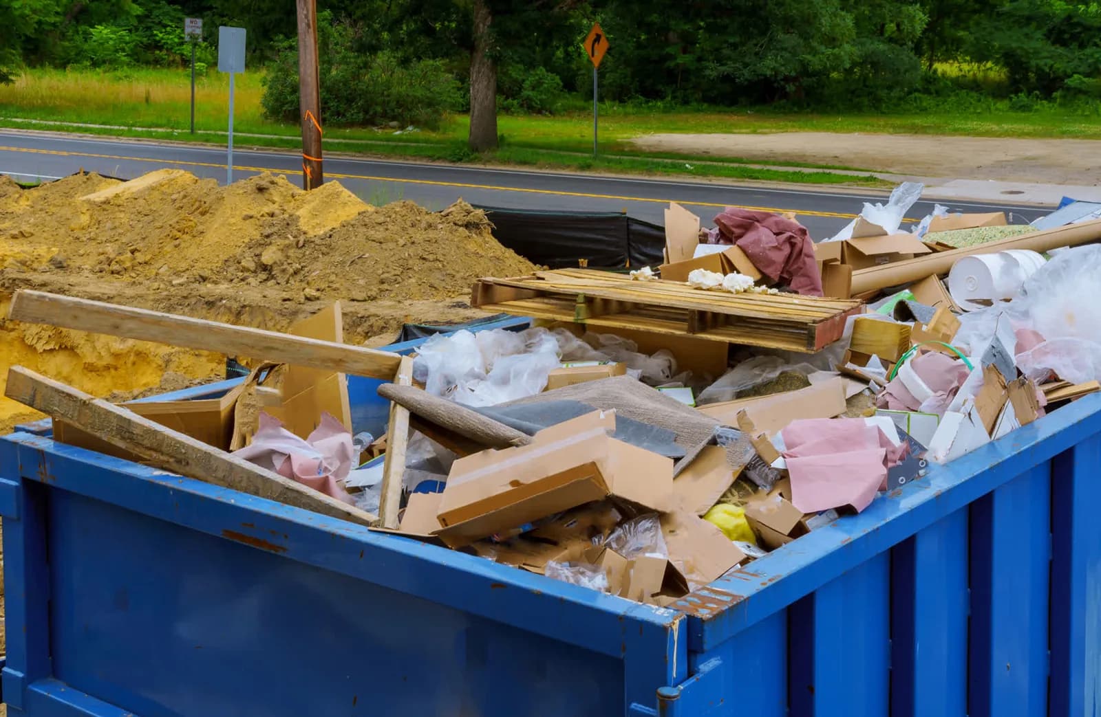 Ultimate Dumpsters roll-off dumpster on a South job site