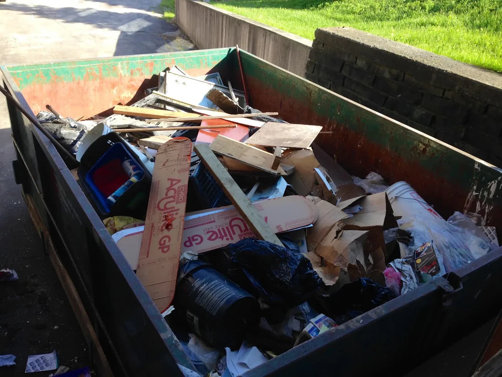 Ultimate Dumpsters roll-off dumpster on a Midwest job site