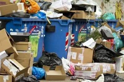 Roll-off dumpster loaded with cleanout and construction debris at a job site (19)