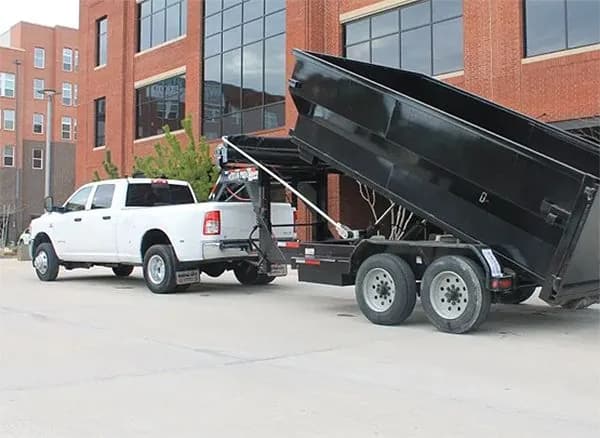Roll-off dumpster loaded with cleanout and construction debris at a job site (31)