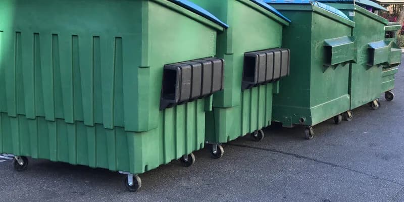 Clean black roll-off container delivered for a same-day dumpster rental