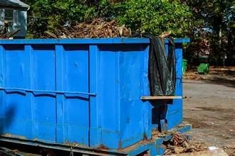 Large roll-off dumpster delivered curbside for a construction rental