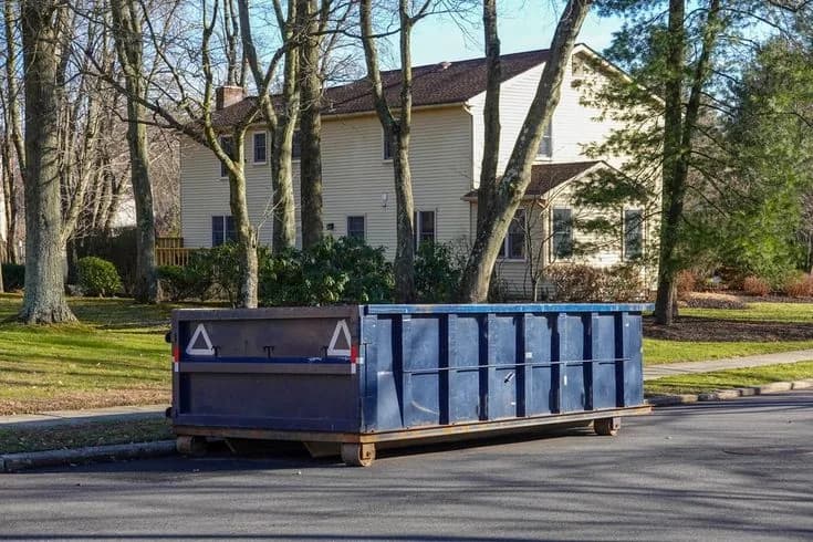 Roll-off dumpster on a truck being delivered to a New York job site